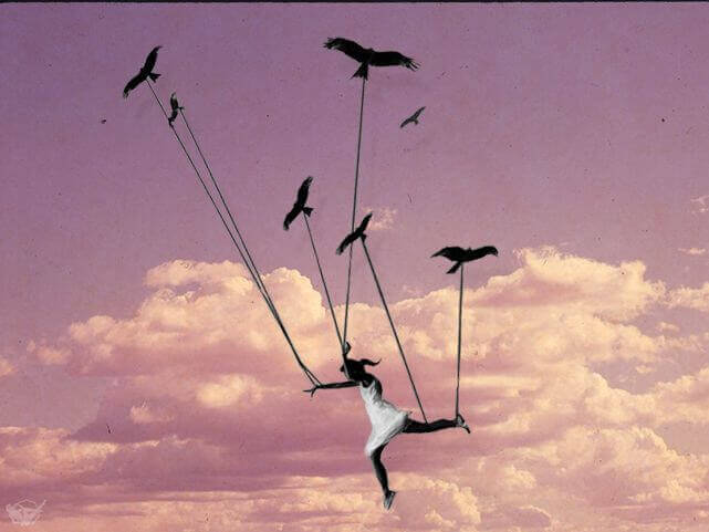 Bambina vola sorretta da uccelli
