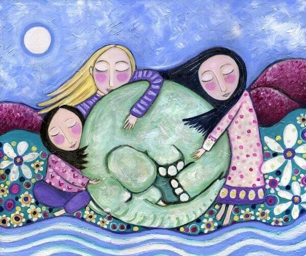 bambine che abbracciano un elefante