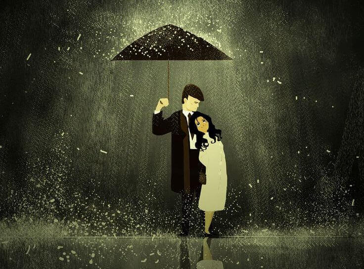 coppia che si protegge sotto l'ombrello