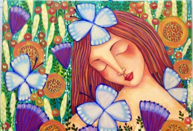 donna circondata da fiori e farfalle