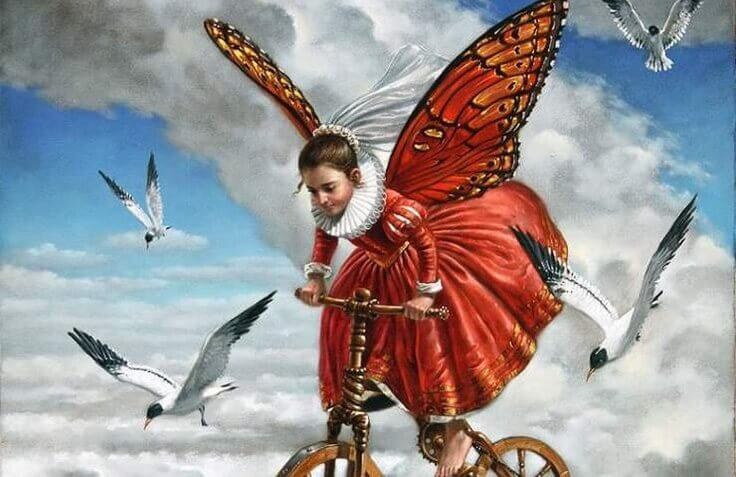 bambina vola sulla bicicletta con i gabbiani