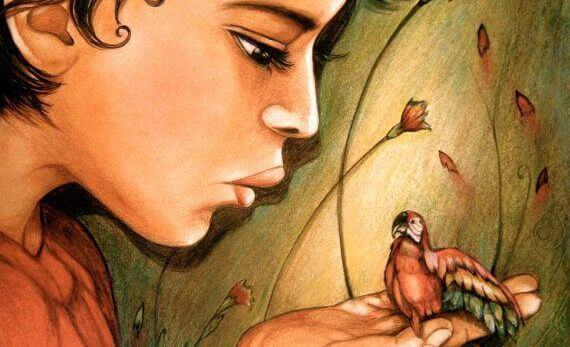 bambio con pappagallo in mano