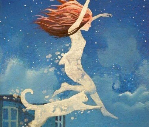 ragazza e gatto saltano