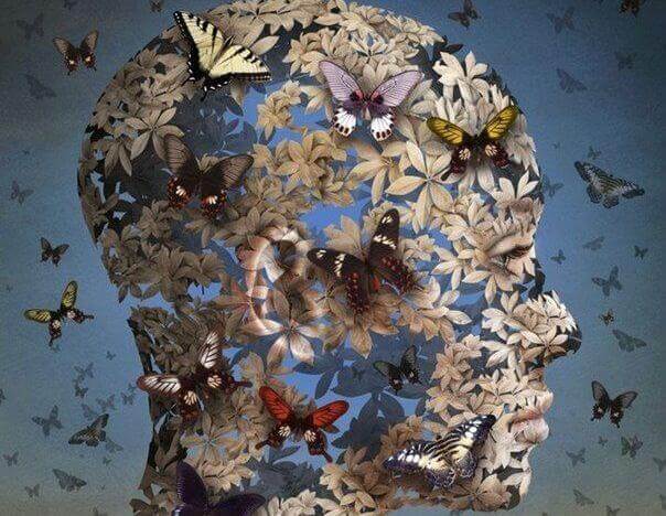testa femminile fatta di farfalle
