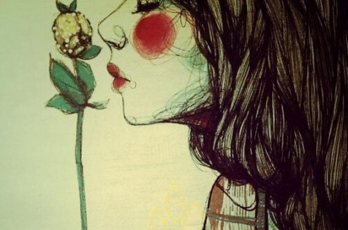 donna che bacia fiore