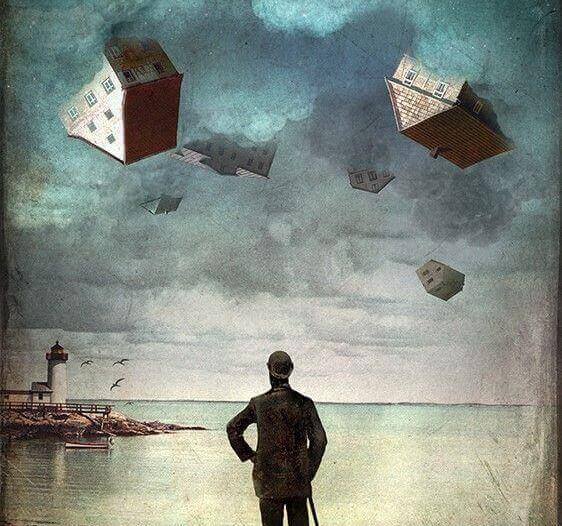 uomo che osserva case in cielo