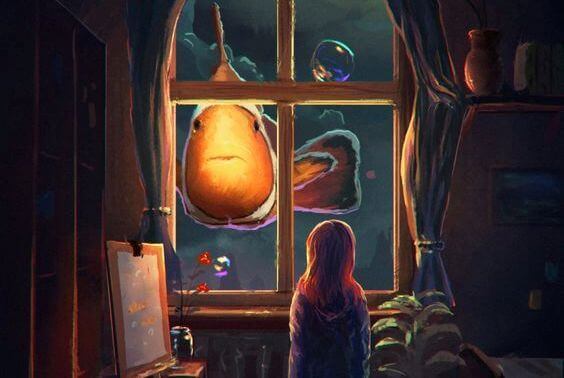 bambina che vede fuori dalla finestra un pesce pagliaccio