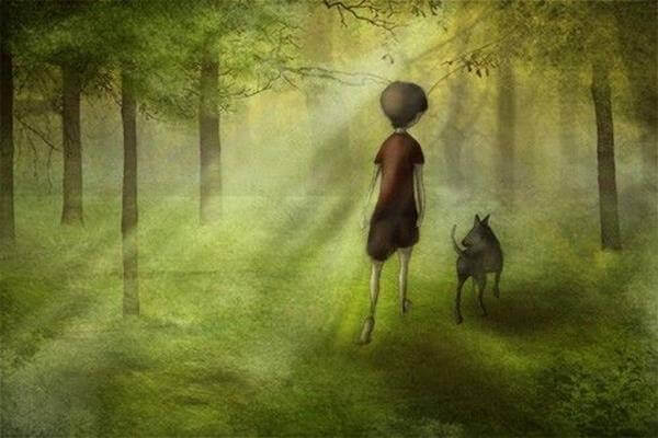 Cane e bambino nel bosco