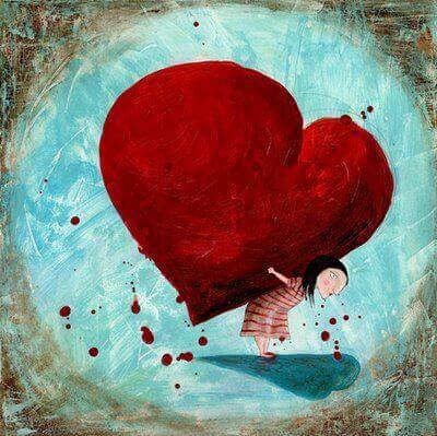 bambina solleva cuore enorme