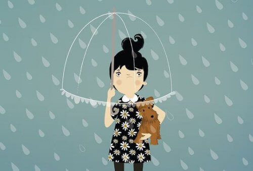 bambina con ombrello e cane in braccio