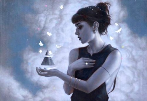 ragazza con triangolo in mano e farfalle bianche