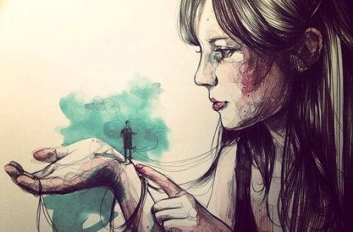 ragazza con piccolo uomo sulla mano