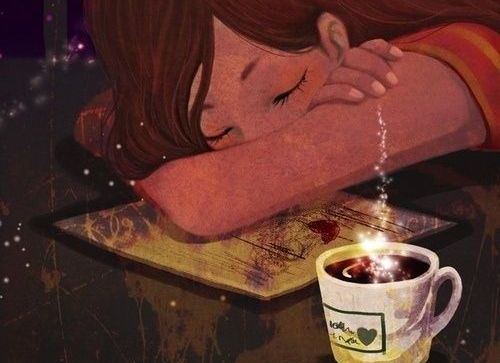 ragazza-dorme-vicino-a-tazza-di-caffe