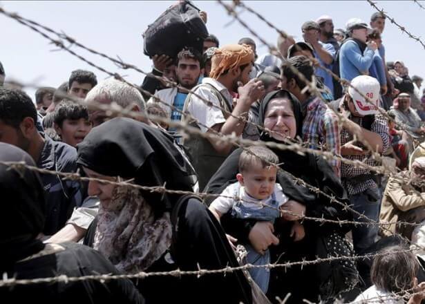 Rifugiati dietro un filo spinato