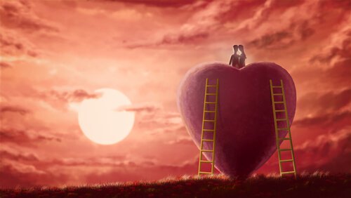 Coppia seduta sopra un cuore che guarda il tramonto