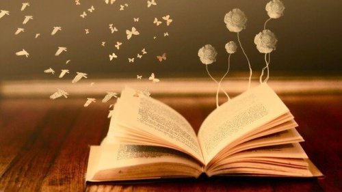 Libro aperto da cui fuoriescono fiori e farfalle