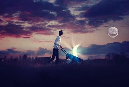 Uomo con carriola e luna