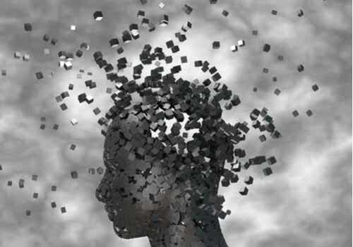 Testa di una persona che si divide in centinaia di quadrati neri.